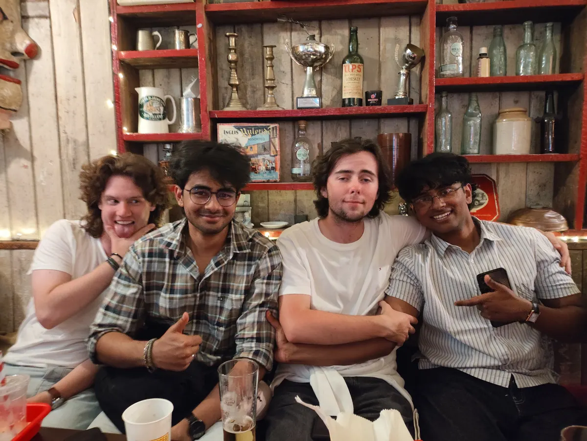 Friends posing together in a pub