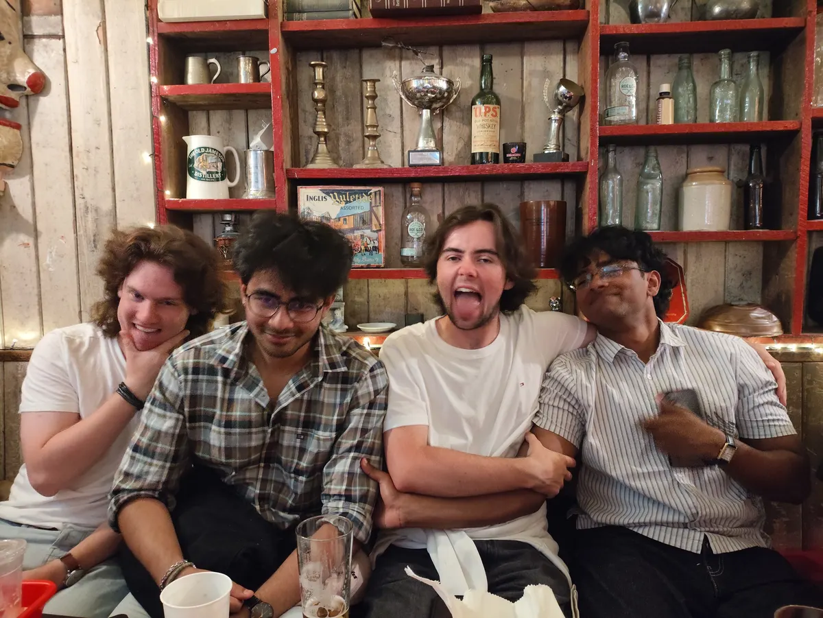 Friends laughing in a pub